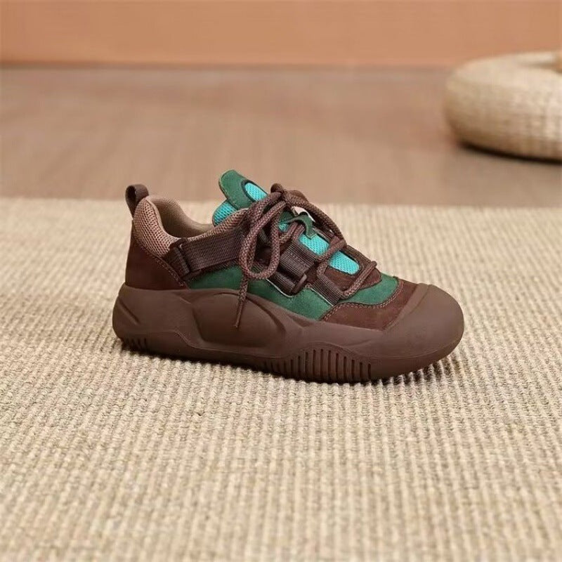 Brown and green sneaker on a textured surface