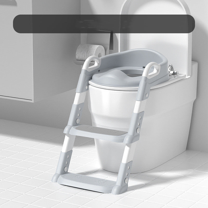 White step stool attached to a toilet in a bathroom setting