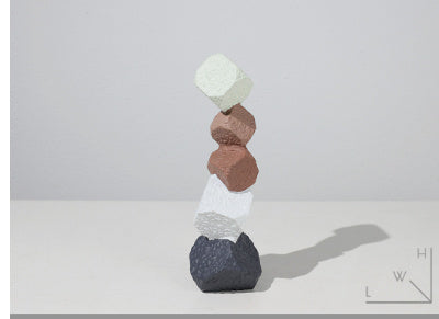 Stack of colorful stacked stones on a white background