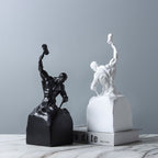 Black and white statues on a gray background