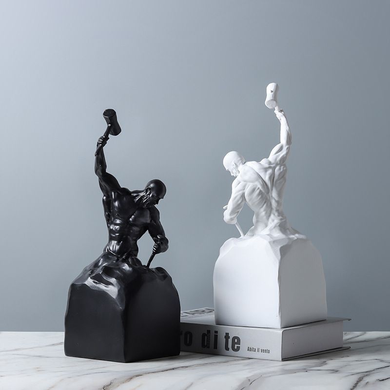 Black and white statues on a gray background