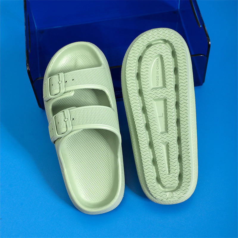 Light green slide sandal with a blue background