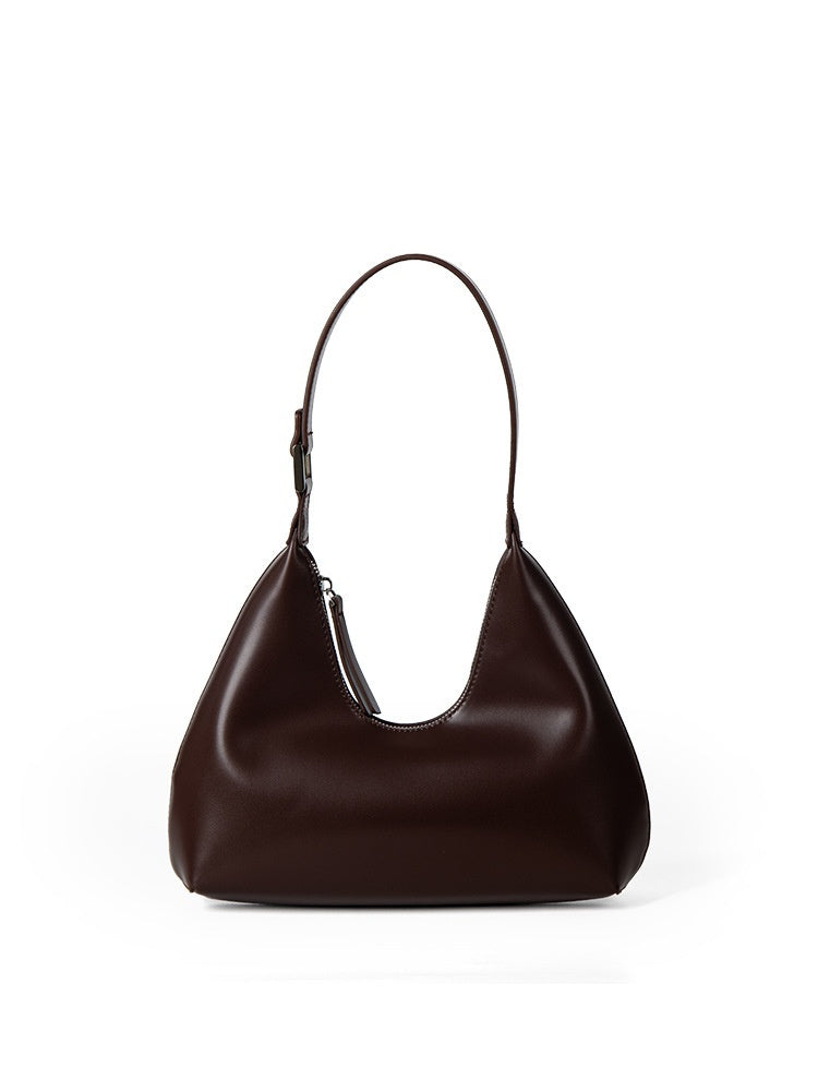 Brown leather handbag on a white background