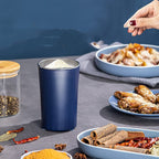 Blue container on a table with food and spices
