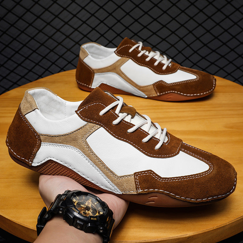 Brown and white sneakers on a wooden surface with a black mesh background