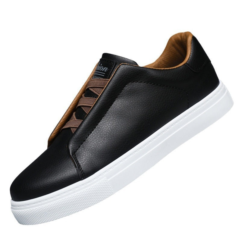Black leather sneaker with brown accents on a white background